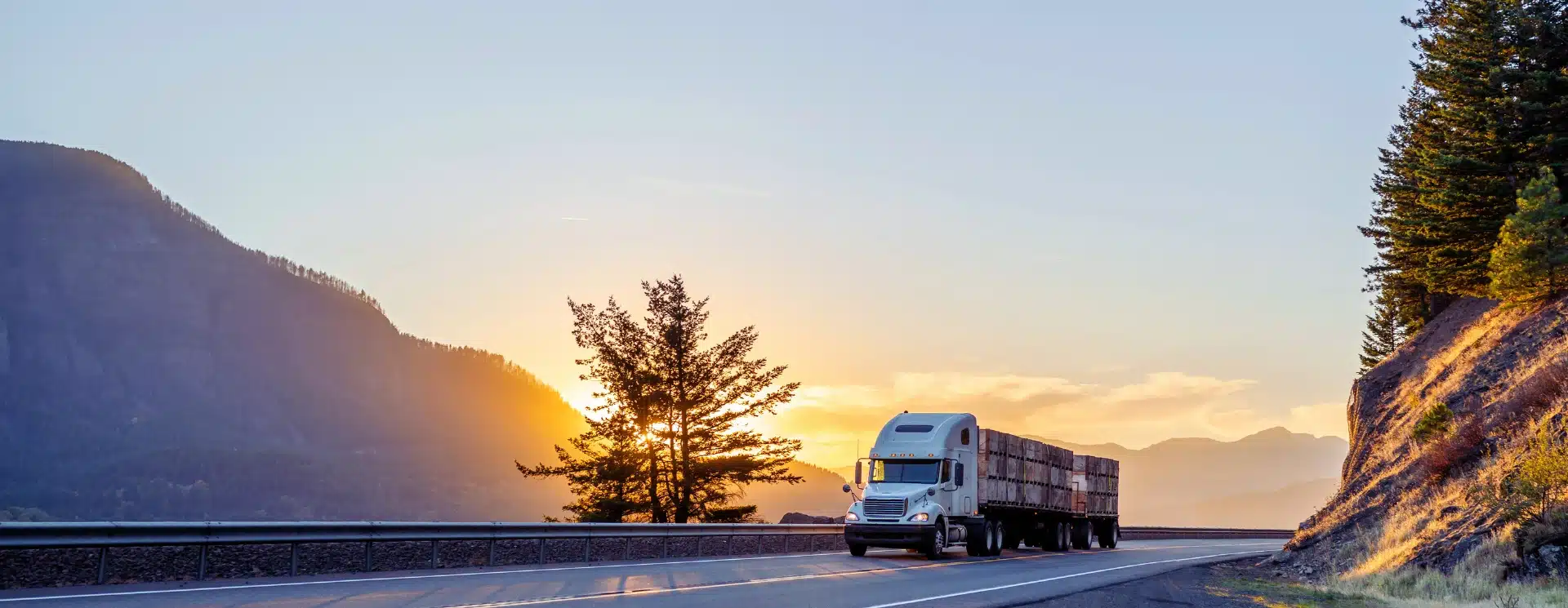 Semi-truck driving at sunset who may need a semi-truck accident lawyer in Clermont, Florida.